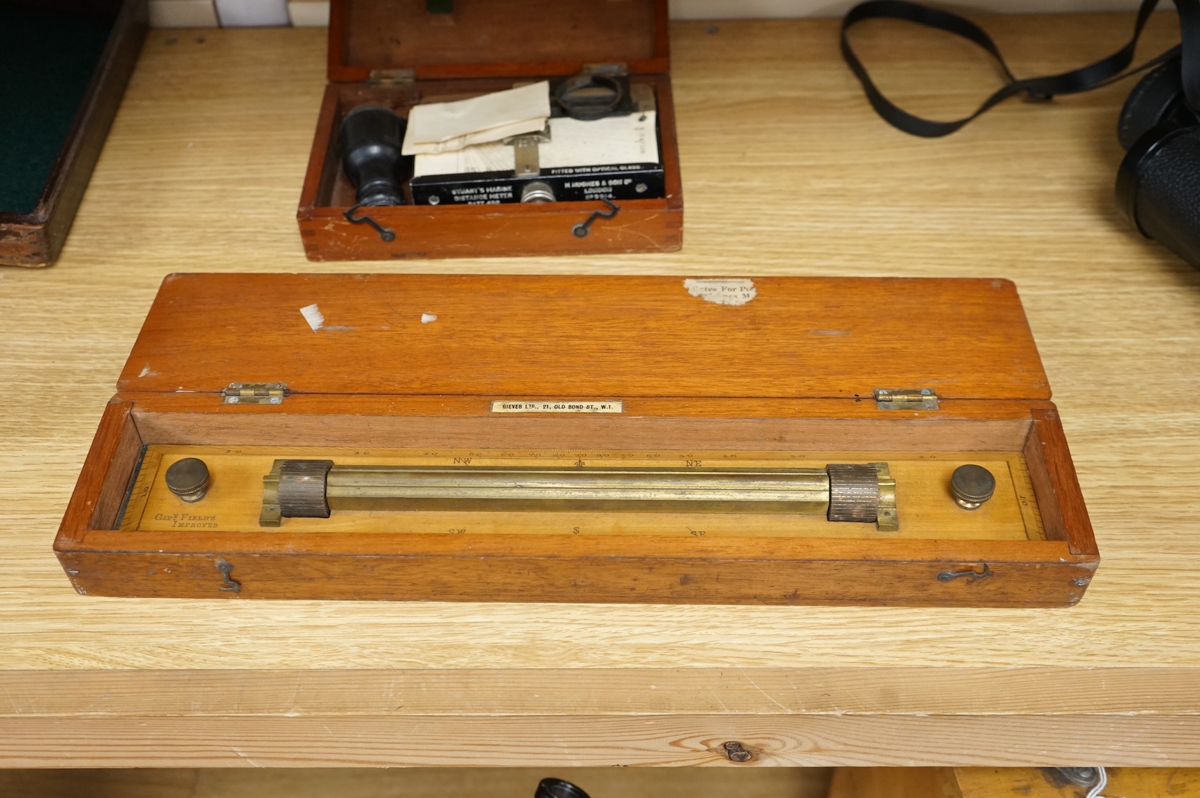 An early 20th century teak cased Stuart's Distance Meter and a late 19th century mahogany cased ‘Capt. Field’s Improved’ protractor by Gieves Ltd., 21 Old Bond Street W.1.